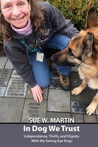 Sue squatting next to guide dog 