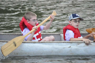 two boys in a canoe