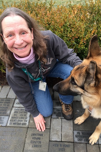 Sue Martin kneeling at Seeing Eye Path to Independence