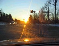 Glare from sunlight on the sidewalk and roadway