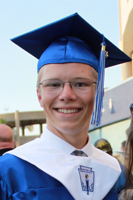 Jake graduation with cap and gown