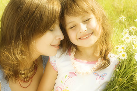 Mother resting outside with her Daughter