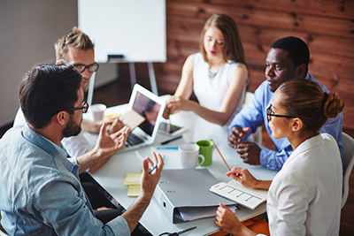 Group of multi-ethnic business partners discussing ideas 