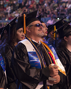 Peer Advisor Steven J. Wilson at his graduation in a cap and gown