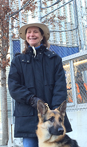 Sue Martin in a hat with her guide dog