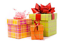 Three presents wrapped in colorful paper and ribbon