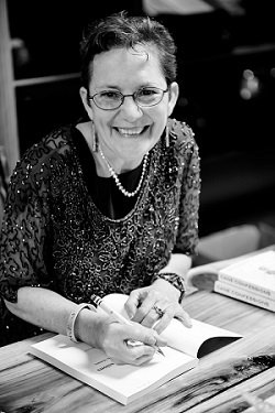 Amy signing book at book signing