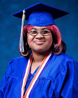 Portrait of Jasmyn Polite in a graduation cap and gown