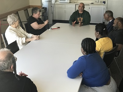 Friedman Place Low Vision Support group members seated around table