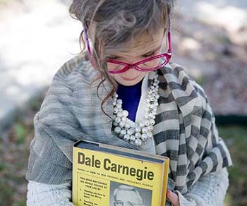 A little girl dressed up to celebrate the 100th day of school