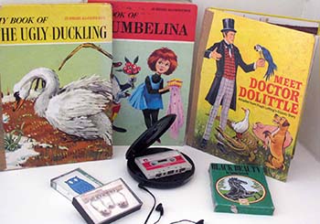a collection of children's books with different types of reading devices