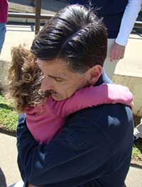 The author and his daughter, hugging