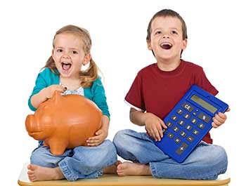 A girl and a boy sitting on the ground; the girl is holding a piggy bank, and the boy is holding a large calculator