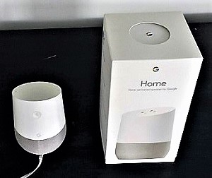 google home device pictured next to packaging box