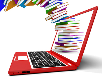A red laptop with a stack of books flying into the laptop