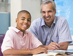 Teacher giving personal instruction to male student