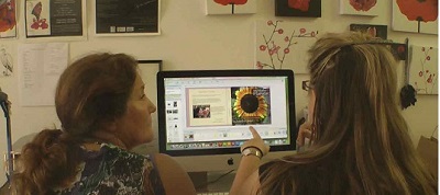 maribel and Bee working on publishing book on computer