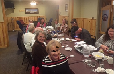 people sitting around dining table