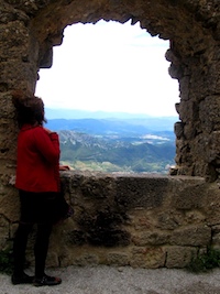 Maribel looking out at the mountains from a look out spot on the hillside