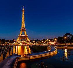 Eiffel Tower lit up at night with over 2,000 light bulbs in Paris, France