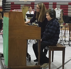 Eddie playing the piano at his sixth-grade holiday band concert