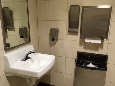 public bath with sink and paper towels