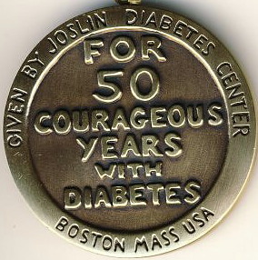 A photo of the Joslin 50-Year Medal. It is inscribed with the words For 50 Courageous Years with Diabetes