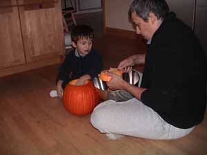 Dad and Matteo carving a pumpkin